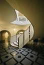 Luxurious marble floor in an opulent building with a curved staircase