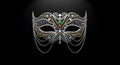 A luxurious mask made from chain links and small gemstones forming an elegant pattern, isolated on a deep black background. Royalty Free Stock Photo