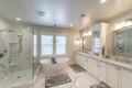 Luxurious master bathroom with marble tiles and window Royalty Free Stock Photo