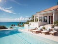 Luxurious Mediterranean-style Villa with pool and lounge chairs, on the horizon you can see the sea