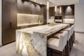 A luxurious and modern kitchen interior. The space features dramatic, large waterfall island made of a beautiful natural stone, Royalty Free Stock Photo