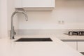 Luxurious modern kitchen with sink, Contemporary kitchen unit with chromed water tap modern white clean concept Royalty Free Stock Photo