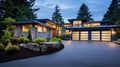 Luxurious new construction home in Bellevue, WA. Modern style home boasts two car garage framed by blue siding and natural stone Royalty Free Stock Photo