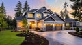 Luxurious new construction home exterior at sunset Royalty Free Stock Photo