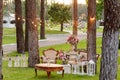 Luxurious photo zone on the green lawn. A place for beautiful pictures at wedding, birthday. Relax reception zone Royalty Free Stock Photo