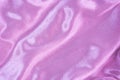 Luxury pink purple silk background. Rippled silk fabric, drapery cloth, or satin texture Royalty Free Stock Photo