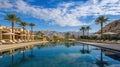 Luxury Resort Pool with Palm Trees and Mountain View, Desert Oasis Landscape Royalty Free Stock Photo