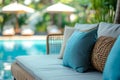 Luxurious Poolside Lounging Area with Elegant Rattan Furniture and Plush Cushions