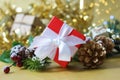 Luxurious red Christmas gift box on gold bokeh lights background Royalty Free Stock Photo