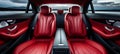 Luxurious red leather back passenger seats in stylish luxury car