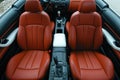 Luxury Car Interior: Red Leather Seats and Modern Console Royalty Free Stock Photo