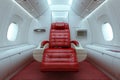 Luxurious red leather first class seat inside an airplane Royalty Free Stock Photo
