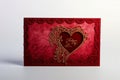 A luxurious red Valentine\'s Day card, adorned with intricate lace patterns along the edges.