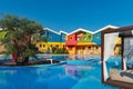 Luxurious resort hotel with pool, colorful houses, Thassos island, Greece