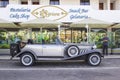 A luxurious silver grey retro Beauford Limousine parked outside a hotel in Albuferia in Portugal