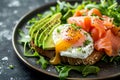 Luxurious smoked salmon and ripe avocado slices under a soft cooked egg with a runny yolk, a healthy gourmet's Royalty Free Stock Photo
