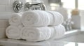 Stack of fluffy white towels sitting on bathroom countertop Royalty Free Stock Photo