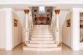 Luxurious staircase with marble steps and decorative and orname