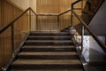 Luxurious staircase with marble steps and decorative and ornamental iron and glass railings. Elegant historical Stairs in a luxury Royalty Free Stock Photo