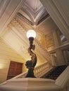 Luxurious stairwell with vintage lamp glowing in the hall of a 5 stars hotel Royalty Free Stock Photo