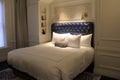 Luxurious suite with king sized bed and deep blue headboard, The Adelphi Hotel, Saratoga Springs, New York, 2018