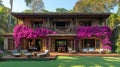 Luxurious, tropical home with a veranda and bougainvillea Royalty Free Stock Photo