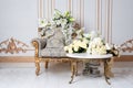 Luxurious vintage interior in the aristocratic style with elegant armchair and flowers. Retro, classics.