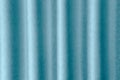 Luxurious wavy blue fabric texture surface curtain wave with a pattern background. macro texture of blue striped fabric Royalty Free Stock Photo