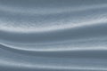Luxurious wavy blue fabric texture surface curtain wave with a pattern background. macro texture of blue striped fabric Royalty Free Stock Photo