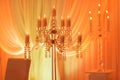 Luxurious wedding table with decor, with silver candlesticks, candles and flowers in blue light. Selective photo Royalty Free Stock Photo