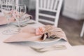 Luxurious wedding table decoration for reception of guests with stylish napkins, cute natural flower Royalty Free Stock Photo