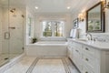 Expensive white bathroom with large rectangular bathtub Royalty Free Stock Photo