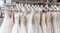 Luxurious white bridal gowns showcased in sophisticated boutique salon, close up view