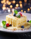 A luxurious white chocolate dessert, garnished with fresh berries on a plate