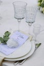 Luxurious white dining table set up for a special occasion with a custom menu Royalty Free Stock Photo