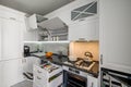 Luxurious white modern kitchen interior, drawers pulled out, doors open Royalty Free Stock Photo