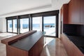 Luxurious wooden kitchen overlooking the sea. Modern kitchen with an island