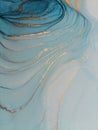 Luxury abstract fluid art painting background alcohol ink technique blue and gold. Swirls of shiny gold edges. Royalty Free Stock Photo