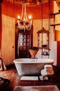 Luxury African tribal hut bathroom interior decoration with old vintage bathtub and chandelier
