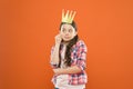 Luxury is anything that feels special. Small cute child wearing luxury prop crown on orange background. Adorable little