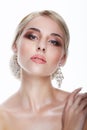 Luxury. Aristocratic Lady Blonde with Jewelry - Platinum Eardrops