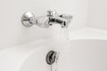 Luxury bath tub and faucet with water. Royalty Free Stock Photo