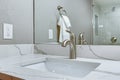 Luxury bathroom interior with marble top washstand.