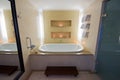 Luxury bathroom with large bath and lit candles Royalty Free Stock Photo