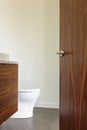 Luxury Bathroom with Open Wooden door Royalty Free Stock Photo