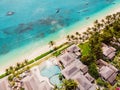 Luxury beach with hotel in Mauritius. Sandy beach with palms and ocean. Aerial view Royalty Free Stock Photo