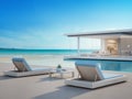 Luxury beach house with sea view swimming pool and terrace in modern design, Lounge chairs on wooden floor deck at vacation home Royalty Free Stock Photo