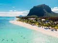 Luxury beach with mountain in Mauritius. Beach with palms and crystal ocean. Aerial view Royalty Free Stock Photo