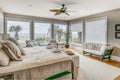 Luxury beach view bedroom looking out onto palm trees and the ocean