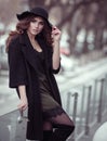 Luxury beautiful woman in black hat, trandy coat and fashion lac
